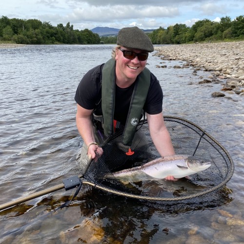 This smiling salmon fly fisher still had the adrenalin flowing through his veins after hooking and taming this perfect Summer salmon on his brand new Loop salmon fly rod. This is what fresh run Summer salmon look like on the River Tummel where this perfect fish was caught. The salmon pool in the photograph is called the 'Mike's Run' pool which is the last River Tummel salmon pool before it joins the River Tay.
