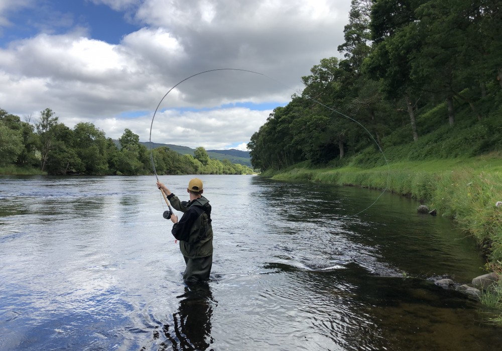 This River Tay salmon fishing guest came to me to learn how to load up his salmon fly rod properly while Spey casting. It didn't take long for me to assist him as you can see in this fine photograph near Dunkeld in Perthshire.