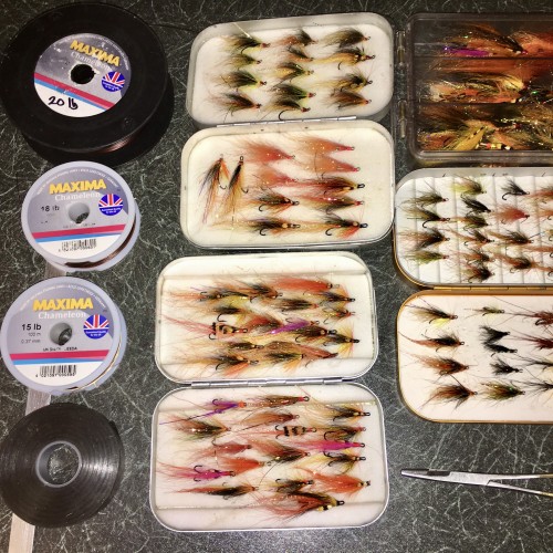 Here's a few different Wheatley of England salmon fly boxes stacked with a few deadly salmon fly patterns. There's Maxima fly leader material there too along with electric tape to secure the rod joints from loosening off while Spey casting. And let's not forget the forceps for the easy unhooking of salmon prior to release.