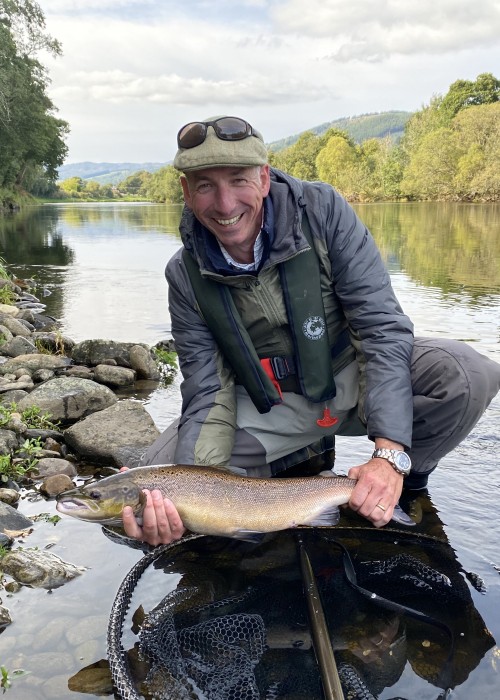 This angler pictured here was holding a boat caught River Tay salmon caught on the Kinnaird Estate's Green Bank Pool near Dunkeld. This fish was handed to him to play while trolling downstream but 20 minutes later he hooked and landed his very first salmon on the fly slightly downstream of where this shot was taken at the March Pool which is another Kinnaird Beat hot spot.