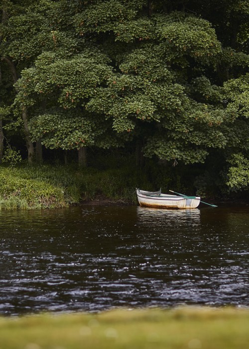 This small River Spey rowing boat is one of many such boats that are used on the River Spey to shuttle fishing guests across the river to the other riverbank. Sometimes they are also used as casting platforms for fishers who aren't comfortable wading in the river.