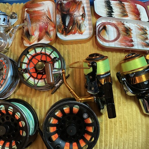 I've always had an obsession with fishing kit since my early childhood days and that obsession hasn't gone away. Look at these reels and salmon flies all getting dried out after a day on the river before getting stored away again.