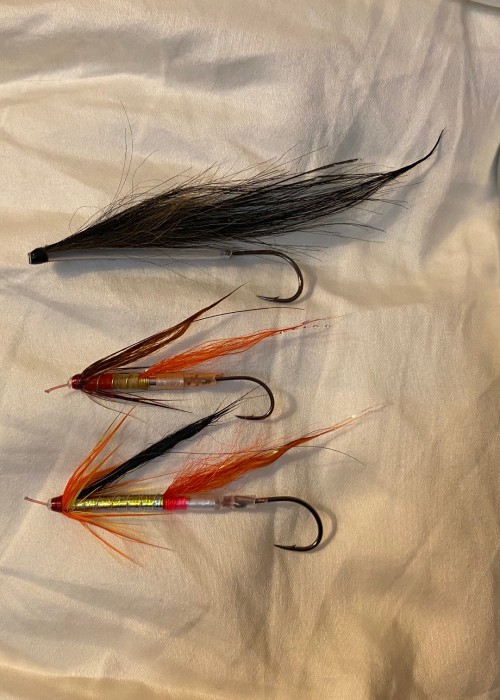 These 3 flies hooked and landed a total of 4 salmon the same day I took this photograph and I was just drying them out after coming off the river before putting them back in their aluminium Wheatley fly box.