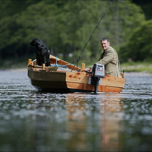 This shot of me and my black labrador dog 'Selkie' was taken on the River Tay near Dunkeld by top Scottish photographer Peter Sandground. The salmon pool we are in here is the Cottar Pool on the Newtye Beat where I was serving as Head Ghillie at that time.