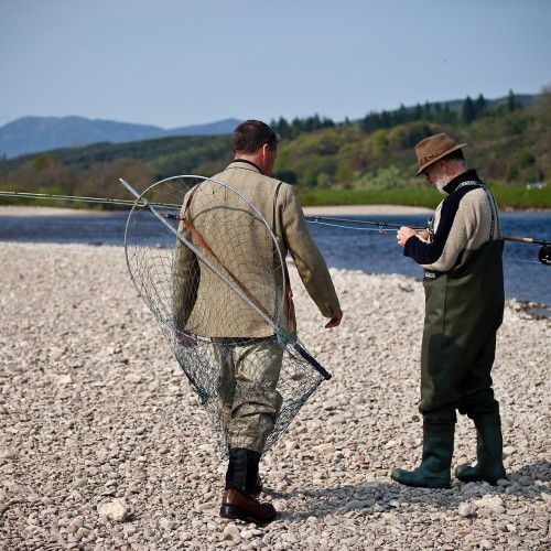 This was a shot of myself with a top UK surgeon who'd just taken up salmon fishing. This is the gravel riverbank at the neck of the Ash Tree Pool at Kinnaird near Dunkeld. Look at the amazing Perthshire hills in the back ground and the fast streamy River Tay salmon water behind us. This lovely shot was taken by top Scottish photographer Louise Bellin.