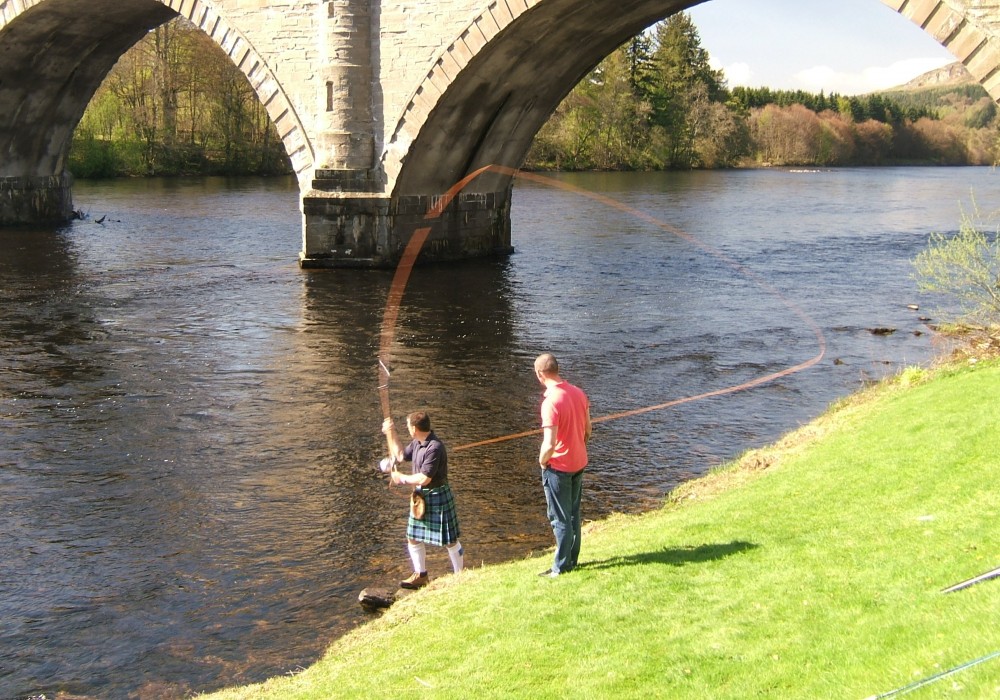 Here's 'Graham Of Menteith' kilted Jock Monteith out teaching the traditional Spey cast underneath the Tay's Telford Bridge at Dunkeld. Look at the perfect D-Loop rod loading perfection.