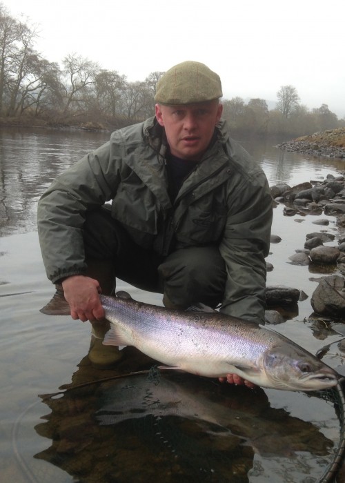Here's River Tay salmon fisher Kev MacKay with a beauty of a Spring salmon of 15lbs which he landed in front of the Kinnaird Beat fishing hut near Dunkeld as 2 other anglers were in the hut complaining about the low cold water conditions!