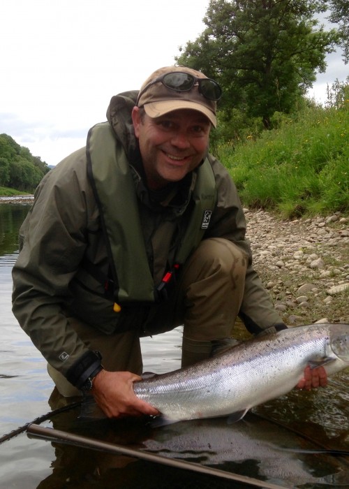 This fine fish was caught while commuting this River Tay guided salmon fishing guest downstream in the boat by flicking a spinning lure over the stern of the boat and letting it flutter in the stream. The lure was deployed slightly above where there was a sharp river bed drop off from 5ft of water down to 20ft at the Rock Pool on Upper Kinnaird. Overall lure troll time to cover this salmon lie is 45 seconds and this fine Tay salmon hit the lure after 15 seconds.