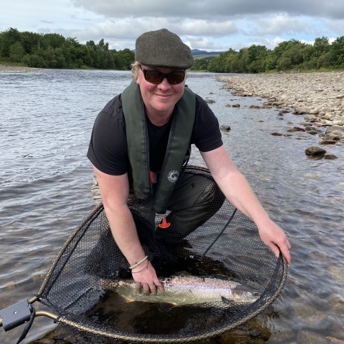 Here's guided fishing guest Tom Wellman with a perfect Summer salmon that was awaiting his fly high up at the neck of the Mike's Run Pool of the River Tummel near Ballinluig. This salmon fought tremendously in this fast water pool before we could get the situation under control via the landing net.