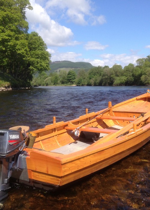 This is a traditional River Tay 'Coble' boat hand constructed from larch & oak. These boats are true works of art and were made in the Perthshire village of Stanley by John Ferguson boatbuilder who's made boats like this for the last 50 years.