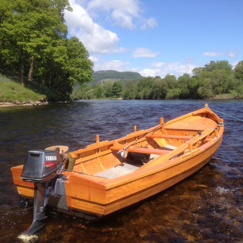 This is a traditional River Tay 'Coble' boat hand constructed from larch & oak. These boats are true works of art and were made in the Perthshire village of Stanley by John Ferguson boatbuilder who's made boats like this for the last 50 years.