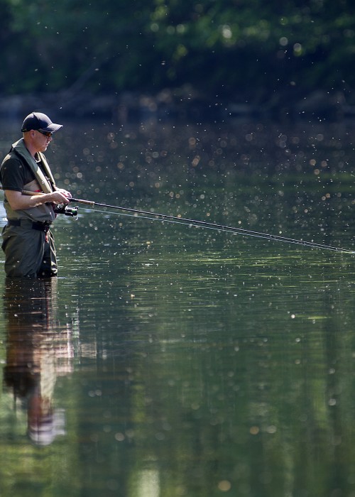Here's a spin fisher out covering a deep water slow flow channel near Dunkeld in Summertime. Salmon take up deep holding positions in Summer when the river temperature is warm and a fast sinking spinner can often be perfect for getting down onto these fish.