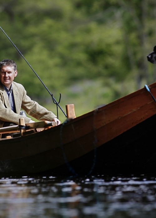 This shot was taken during Summertime of me and my dog 'Selkie' on the River Tay near Dunkeld by top photographer Peter Sandground. You can see my salmon fly rod and landing net ready for instant deployment.