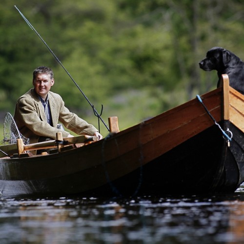 This shot was taken during Summertime of me and my dog 'Selkie' on the River Tay near Dunkeld by top photographer Peter Sandground. You can see my salmon fly rod and landing net ready for instant deployment.