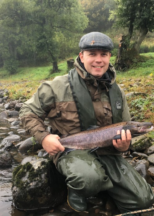 Poor rising water conditions via prolonged heavy rainfall didn't stop the smile from this happy Austrian salmon fisher holding this Autumn River Tay salmon that he'd just landed on the fly at the Trap Pool on the Newtyle salmon beat near Dunkeld.