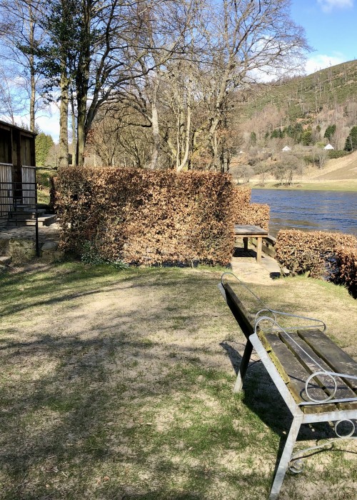 This green lawn at the Newtle Beat fishing hut has been raised up and covered with flood water sand over the last 30 years which hides the grass. To the left of the bench there used to be a wishing well which was build by River Tay ghillie legend Willie Laird who was the ghillie here from 1936 to 1986.